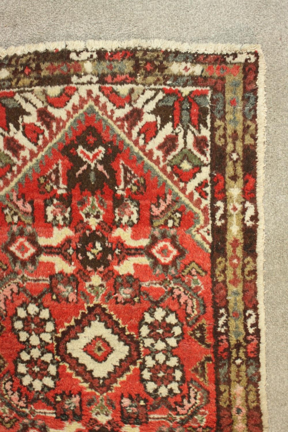 A hand woven red Persian Hamadan with central medallion on burgundy ground within spandrels and - Image 4 of 5
