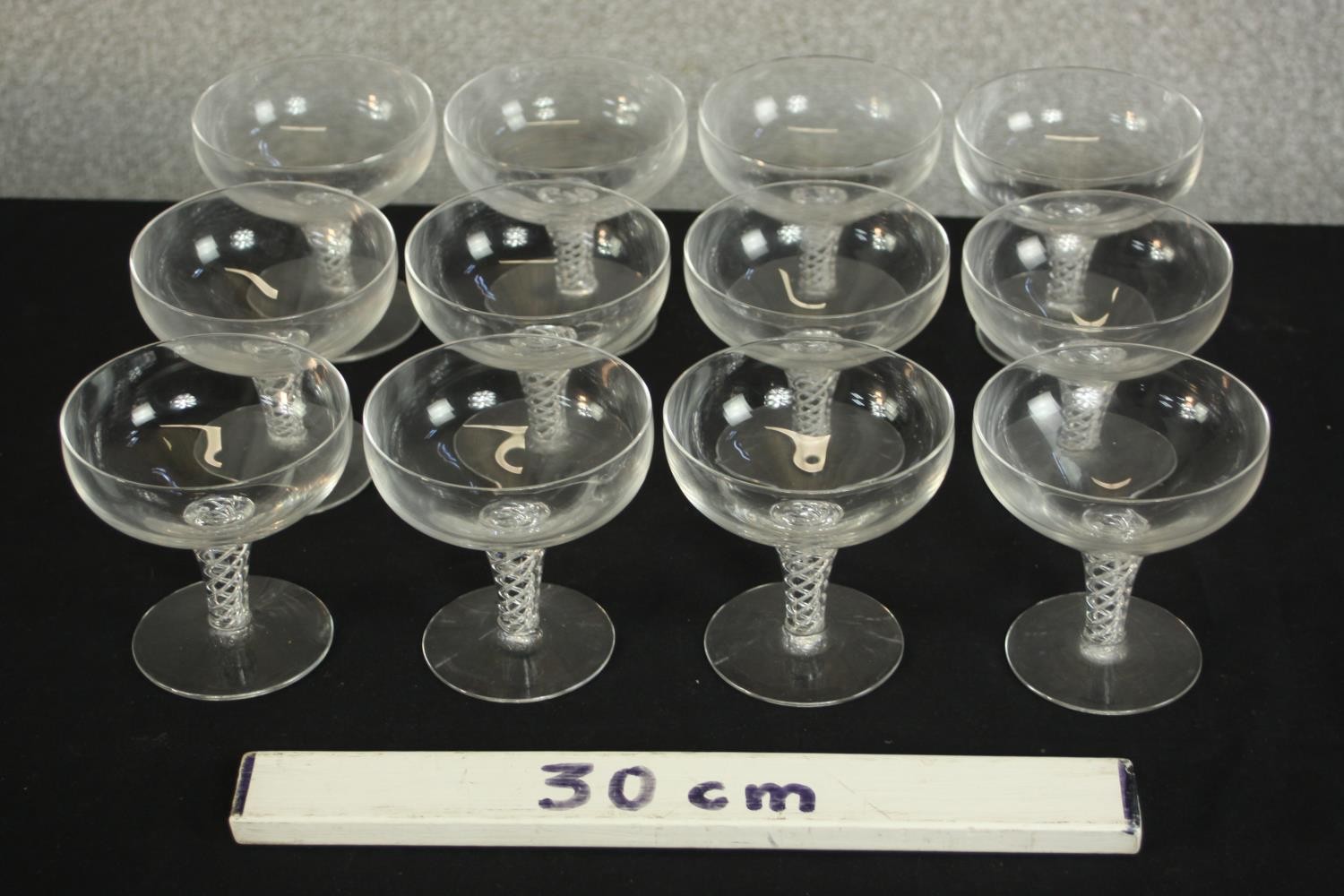 A set of twelve clear glass air twist stem champagne coupes. H.20 Dia.10cm. (largest) - Image 2 of 6