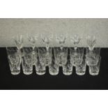 A collection of nineteen hand cut crystal glasses, including six whisky tumblers and seven