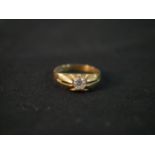 A 9ct gold cubic zirconia gypsy ring with carved star design, stamped 375. Ring size G.