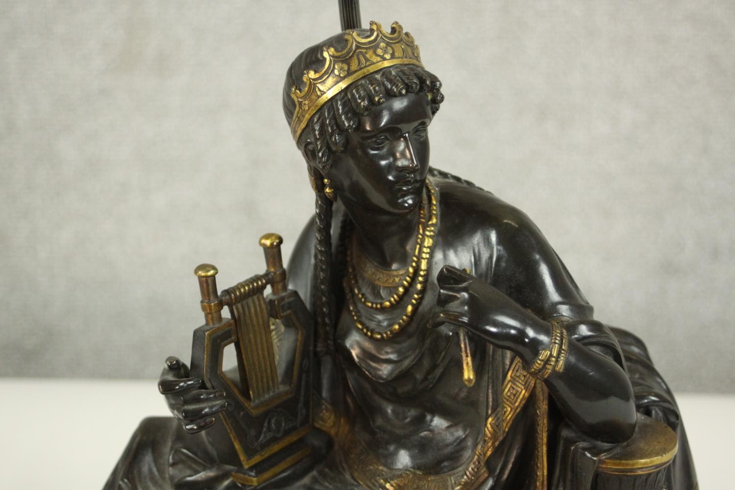 An Egyptian revival gilded bronze figural table lamp depicted as a female in flowing robes holding a - Image 3 of 7