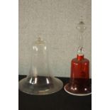 A ruby and white glass Victorian table bell along with a clear blown glass bell. H.35 Dia15cm. (