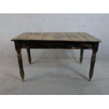 A Victorian painted pine rectangular table, with a plank top on turned legs. H.74 W.138 D.90