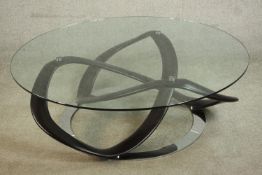 A contemporary Italian Porada Infinity glass topped coffee table, with a circular plate glass top,