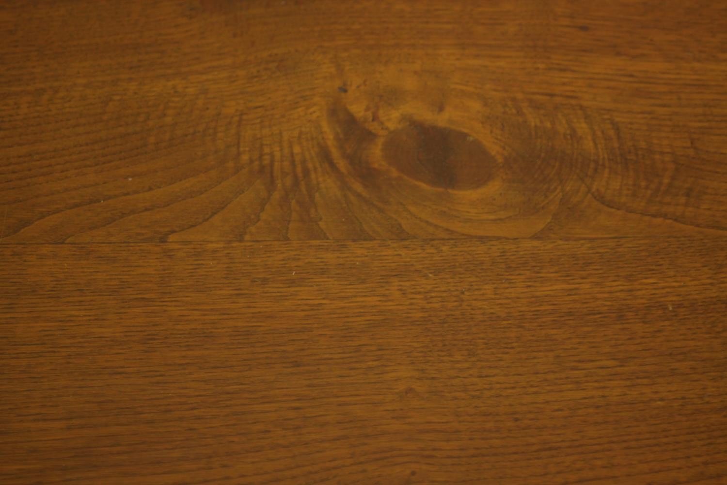 A 20th century oak drop leaf wake table, the oval top with two drop leaves raised on gate legs and - Image 12 of 12