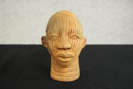 A Yoruba, Nigeria terracotta clay head. H.16 W.11 D 13cm