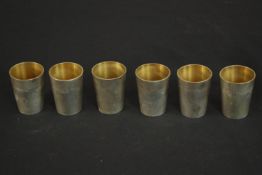 A set of six German silver shot glasses by Adolf Kander with gilded interior. German hallmarks to
