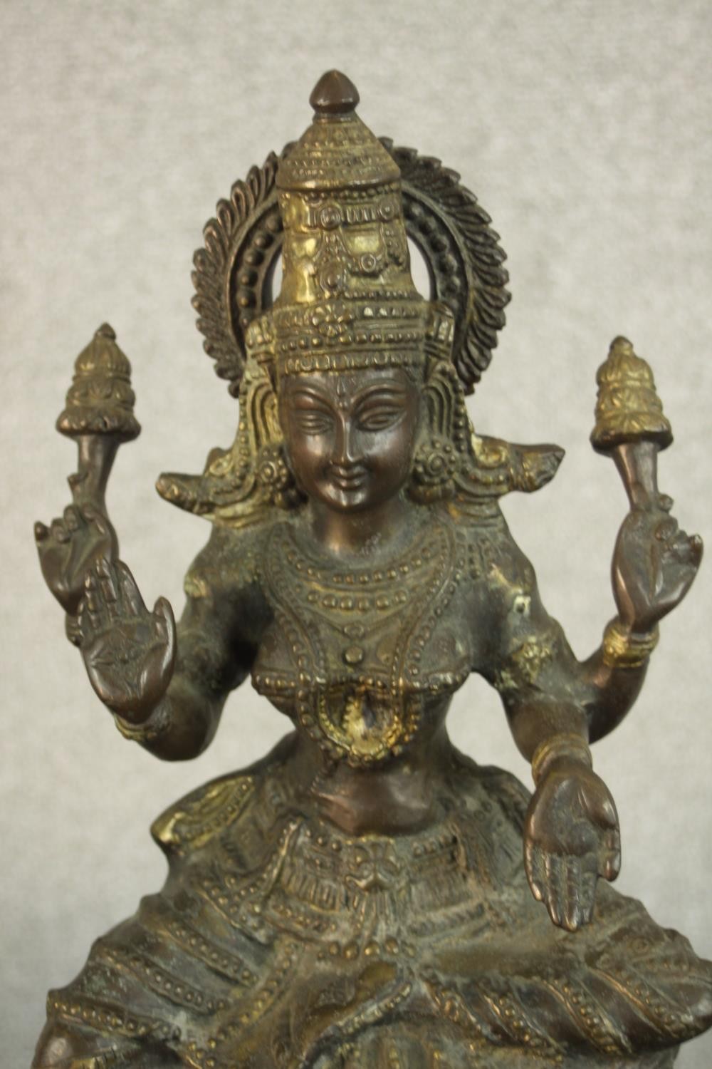 An early 20th century brass figure of the Indian deity Lakshmi on a lotus form base. (Damaged.) H.43 - Image 3 of 9