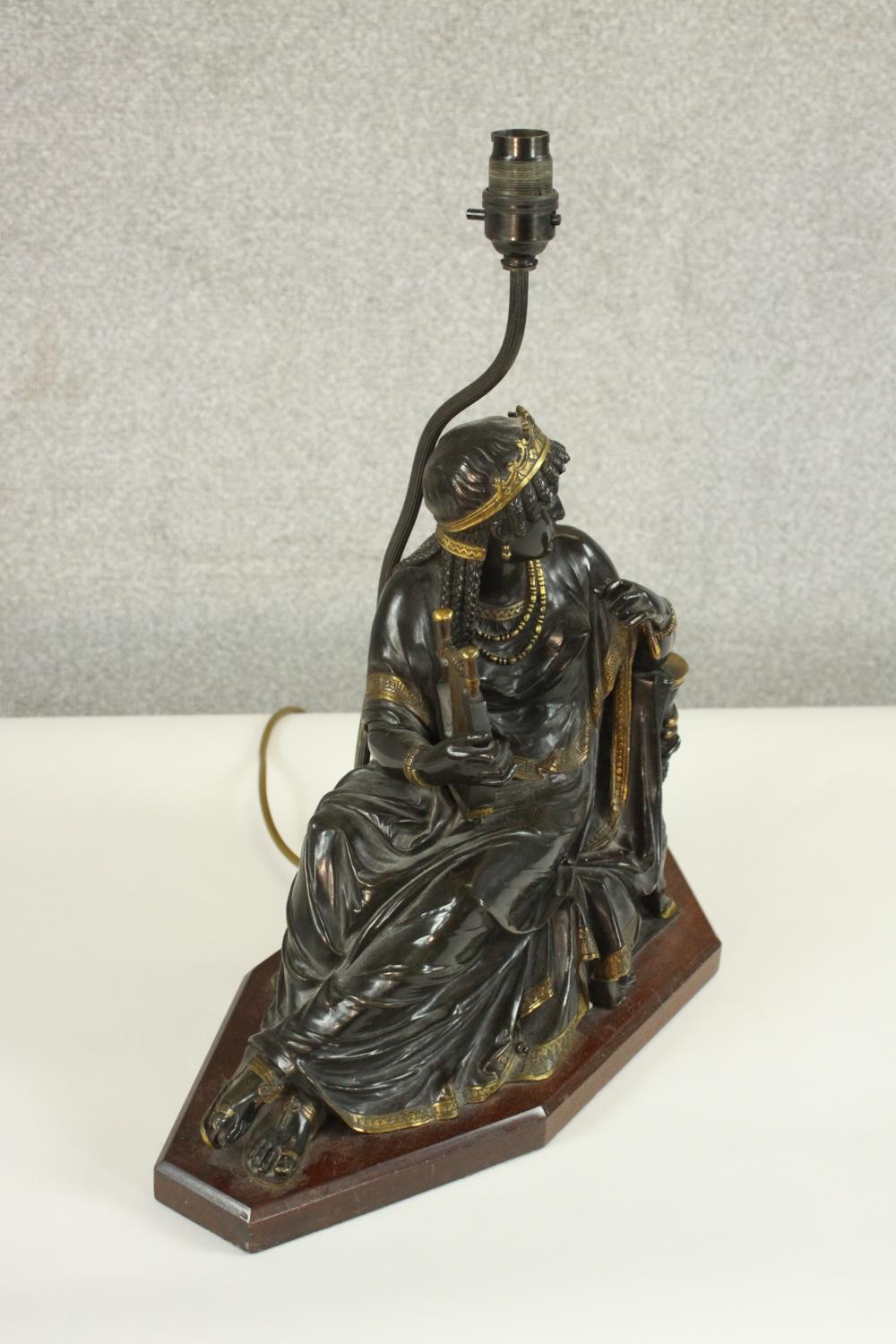 An Egyptian revival gilded bronze figural table lamp depicted as a female in flowing robes holding a - Image 6 of 7