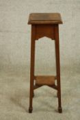 An Arts & Crafts oak jardiniere stand, the square top with a moulded edge on square section legs