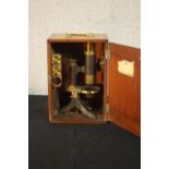 A 19th century mahogany cased students microscope with spare lenses. H.27 W.18 D.14cm. (box)