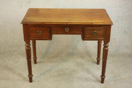 A 19th century mahogany kneehole writing table, the rectangular top with a moulded edge over three