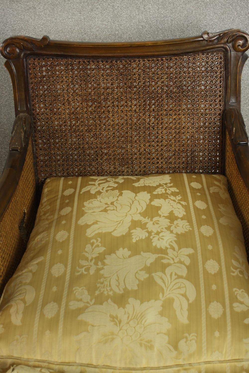 A pair of early 20th century Continental carved walnut bergere armchairs, upholstered in gold - Image 5 of 30