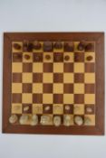 A late 20th century hardwood chess board and chess pieces, complete.