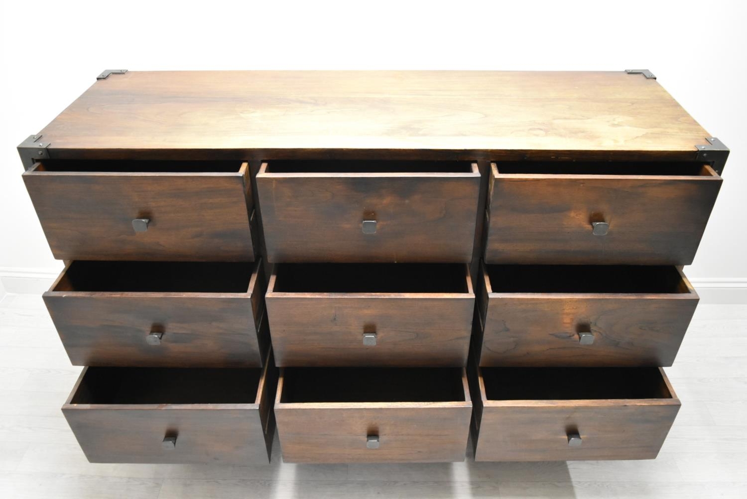 A contemporary Eastern hardwood sideboard with nine drawers raised on short supports. H.100 W.160. - Image 10 of 11