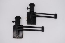 A pair of wall mounted extendable light fittings. Extended H.18 L.53cm