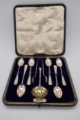 A cased set of six George V hallmarked silver teaspoons, complete with sugar tongs and sifting