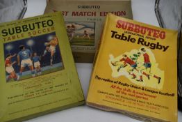 Three boxed Subbuteo Rugby, Cricket and Football games. (Some missing pieces, well used)