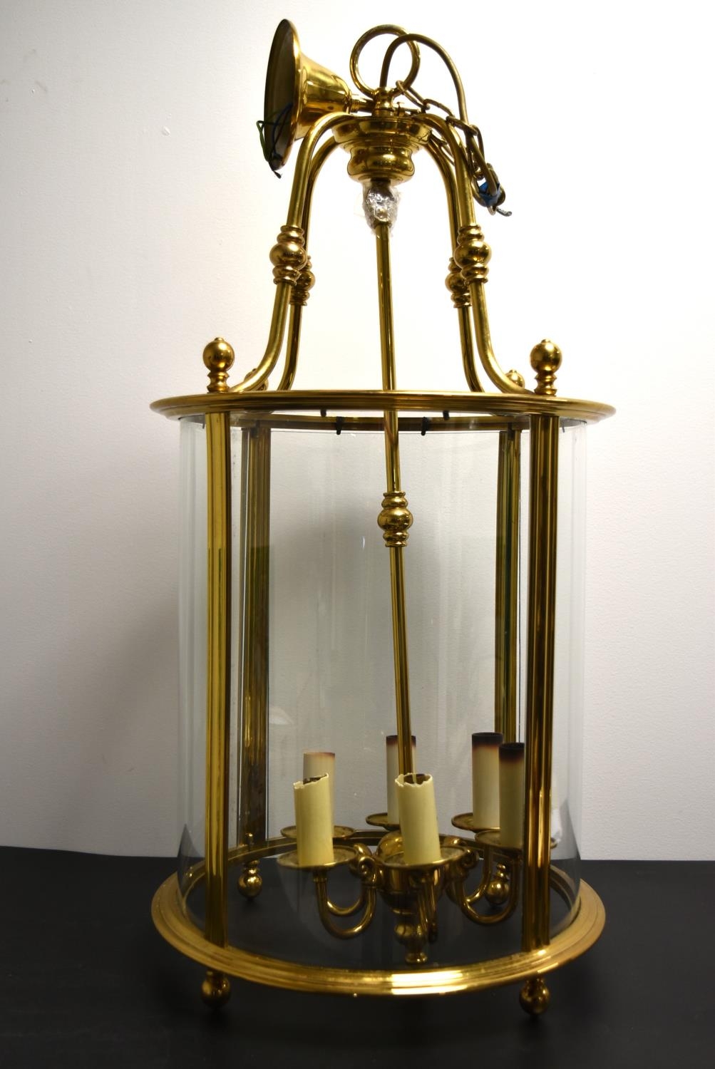 A 20th century brass and glass cylindrical hanging lantern with six branches for lightbulbs. H.82