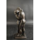 A contemporary patinated bronzed figure group of Adam and Eve raised on shaped plinth base. H.35cm
