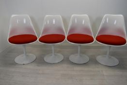 After Eero Saarinen, a set of four vintage Tulip style chairs with plastic shells raised on