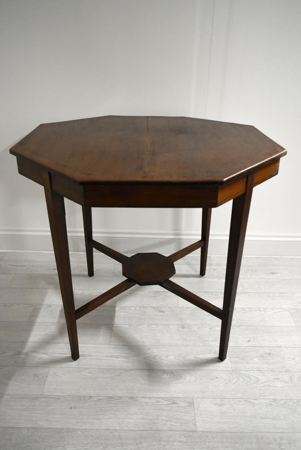 An Edwardian mahogany octagonal occasional table on tapering supports united by stretcher. H.68.5 - Image 4 of 17
