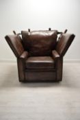A contemporary drop arm brown leather Knole armchair. H. W. D. cm