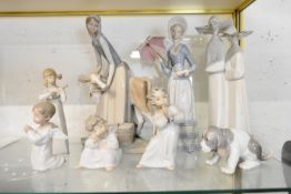 Eight assorted Lladro pottery figures to include children and nuns, marks to base.