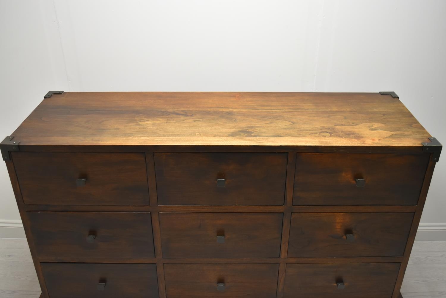 A contemporary Eastern hardwood sideboard with nine drawers raised on short supports. H.100 W.160. - Image 2 of 11