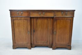 A 19th century mahogany inverted twin pedestal sideboard, with three drawers above three cupboard