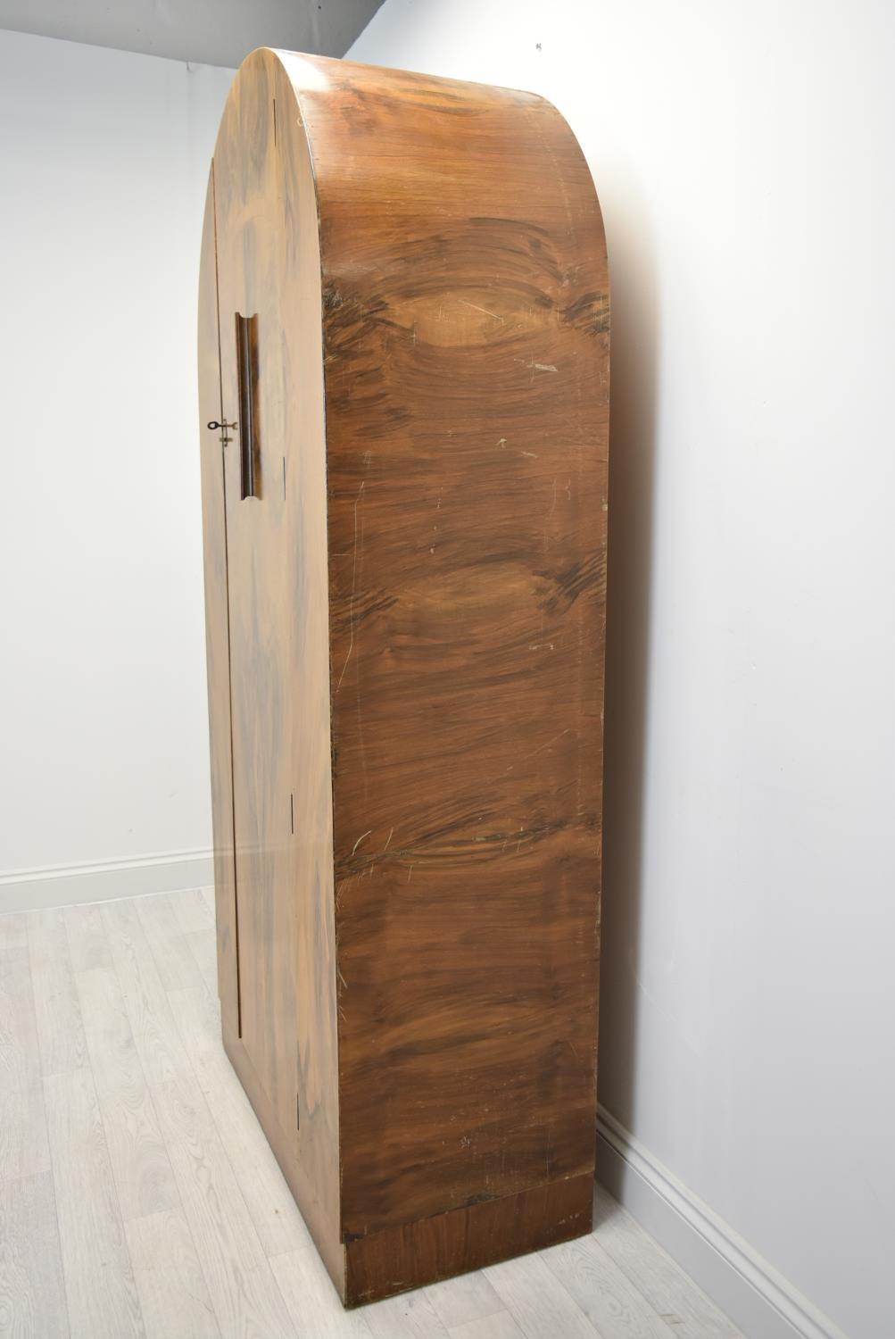 An Art Deco walnut veneered dome topped and twin door wardrobe, opening to reveal mirror, raised - Image 7 of 15