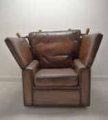 A contemporary drop arm brown leather Knole armchair. H. W. D. cm