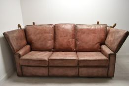 A contemporary three seater brown leather Knole settee with drop arms . H.90 W.198 D.100cm (