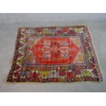 A red ground hand made Turkish Anatolian rug. W.160 D.130cm