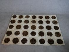 A Cowstar astrakhan sheep skin and cow hide rug with spotted design, label to back. W.172 D.116cm