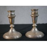 A pair of sterling silver weighted candlesticks with pierced galleries. Stamped Sterling, 925. H.