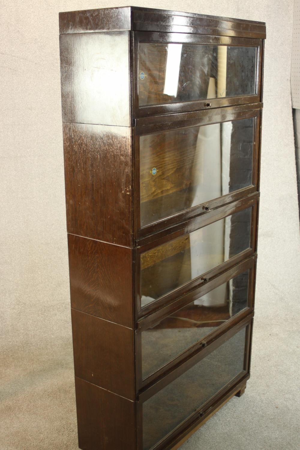 A mid 20th century Globe Wernicke oak stacking bookcase, the five sections with raising glass doors, - Image 4 of 8