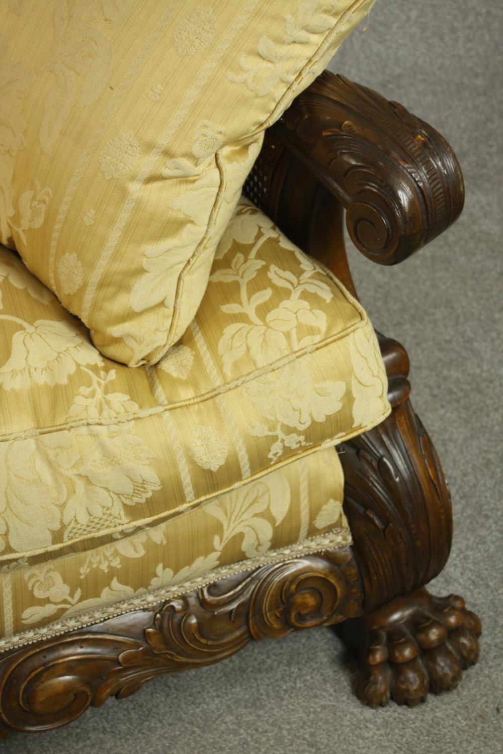 An early 20th century Continental carved walnut three seater bergere sofa, upholstered in gold - Image 6 of 18