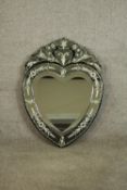 A Venetian style heart shaped wall mirror with shaped bevelled plate within etched foliate
