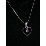 A 18 carat white gold openwork heart pendant and snake chain. The pendant set with a round mixed cut