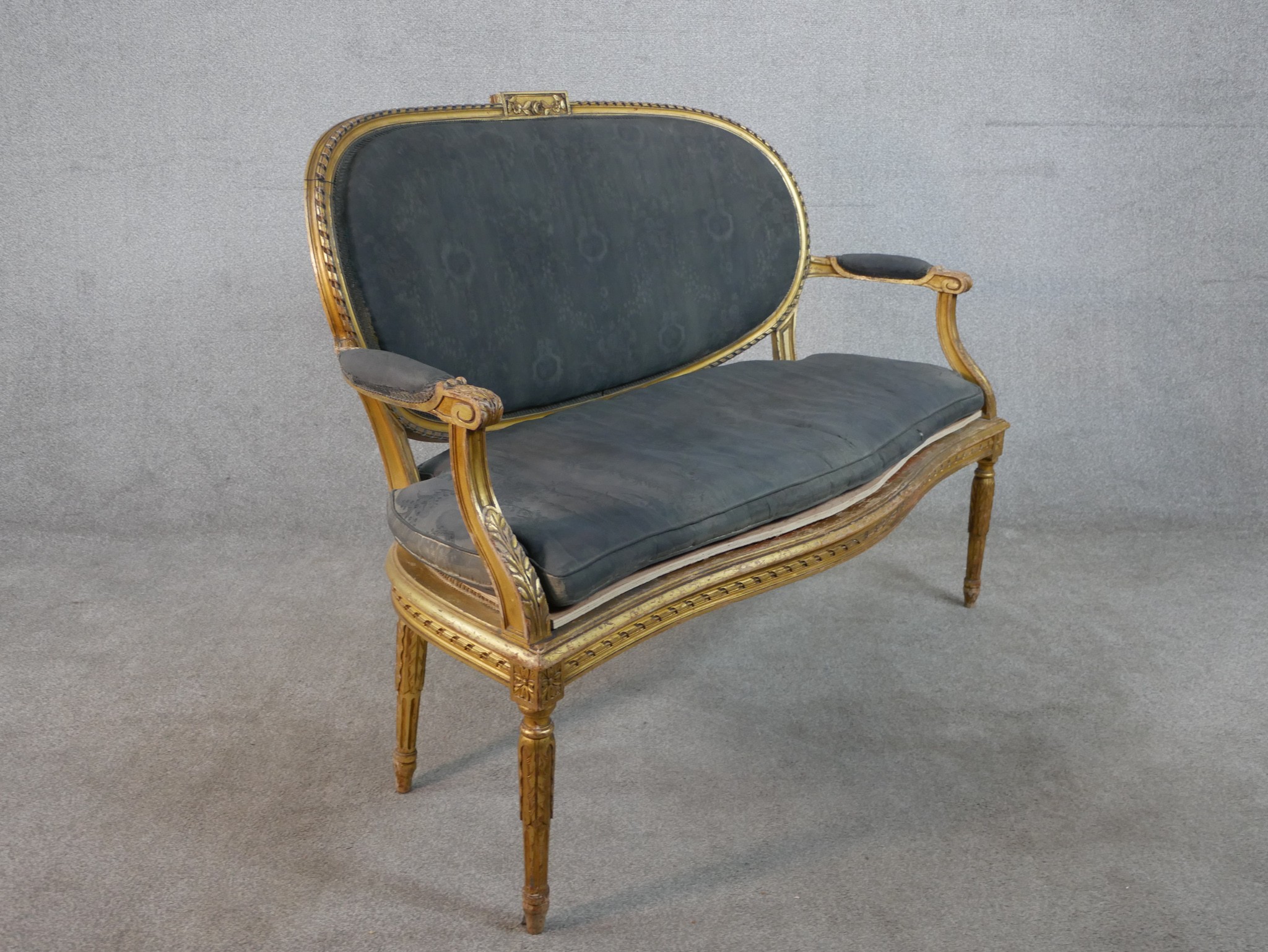 A French Louis XVI style carved giltwood canape, upholstered in grey fabric to the oval back, the - Image 6 of 6