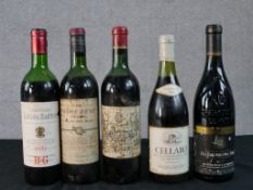 Five bottles of red wine, including Chateauneuf-du-Pape and a 1964 Pomerol.