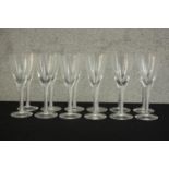 A set of twelve clear glass air twist stem champagne glasses. H.17 Dia.7cm. (largest)