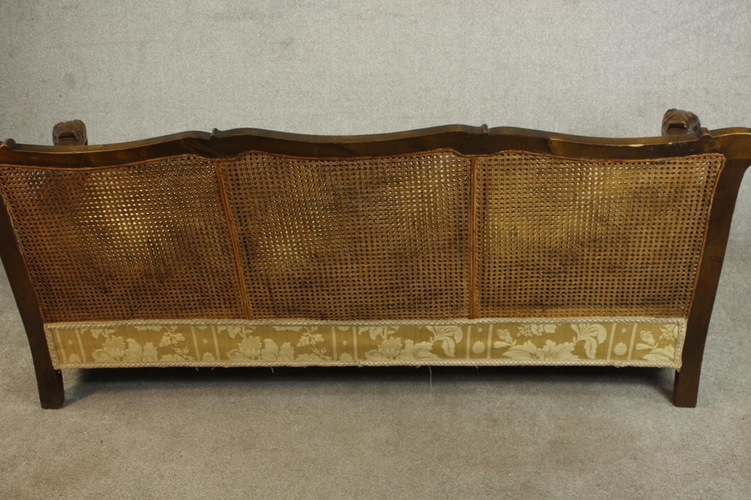 An early 20th century Continental carved walnut three seater bergere sofa, upholstered in gold - Image 15 of 18