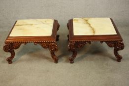 A pair of late 20th century carved hardwood low side tables, with a square onyx top and a