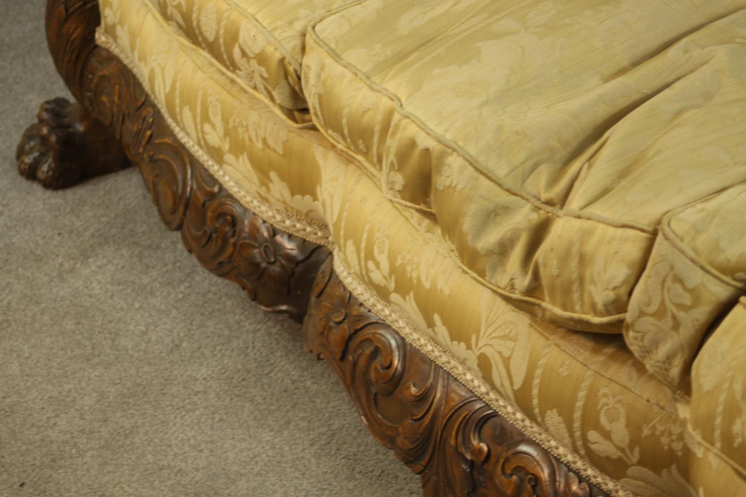 An early 20th century Continental carved walnut three seater bergere sofa, upholstered in gold - Image 14 of 18