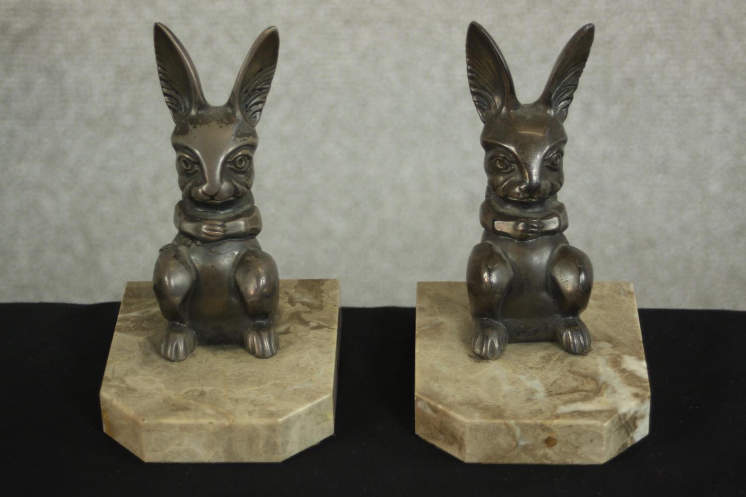 H.Moreau, a pair of Art Deco silvered metal rabbit bookends on marble bases, signed in cast 'H.