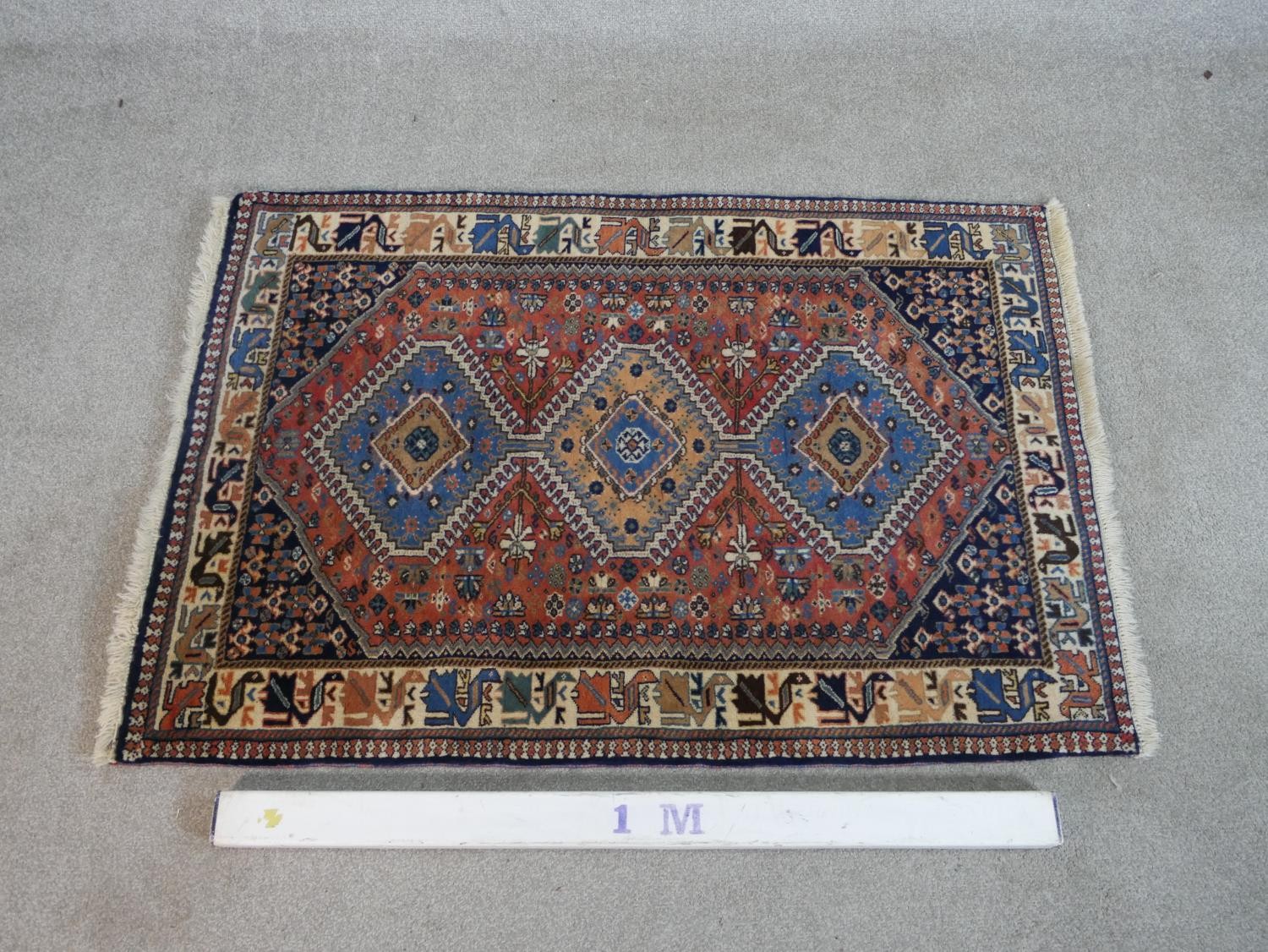 A rust ground hand made Persian Yalameh rug. W.126 D.86cm - Image 2 of 3