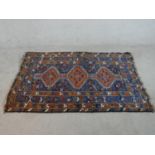 A blue ground hand made Persian Shiraz rug. W.177 D112cm