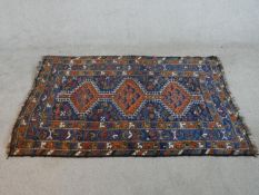 A blue ground hand made Persian Shiraz rug. W.177 D112cm